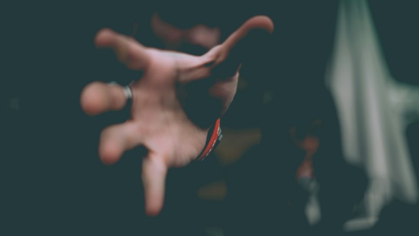 Reaching out threateningly